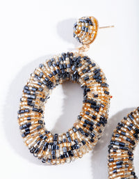 Gold & Navy Oval Bead Earrings - link has visual effect only