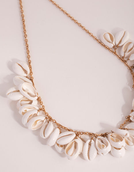 Gold cowrie shell necklace outlet