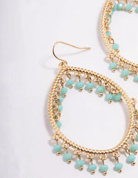 Gold Oval Teardrop Blue Bead Chandbali Earrings - link has visual effect only